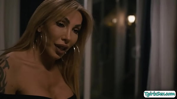 Beautiful blonde transsexual Eva Paradis flirst with hunk guy Dante Colle caressing his bigcock until she is down masterfully deepthroats. 