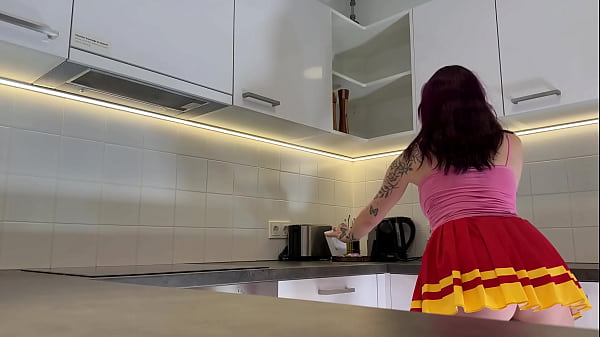 Hottest redhead tattooed cheerleader_with over knee socks shows her see through panties in the kitchen