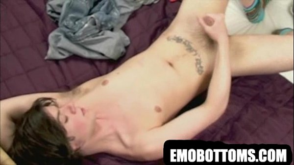 A hot tattooed punk twink is jerking his cock off
