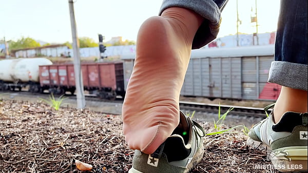 My feet in nylons teasing outdoor