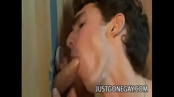 White gay dude pleases cock on the glory hole