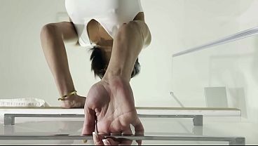 Over knee socks wearing hot and horny brunette slut in a flying short skirt show her ass 