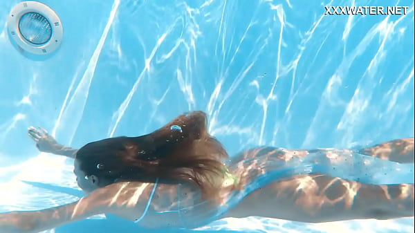 Petite teen Ivi Rein endures the free naked swimming 