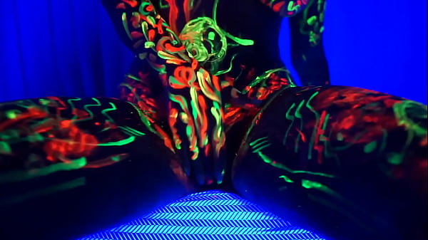 Redhead Amelia masturbates with her body painted and shelistens to music