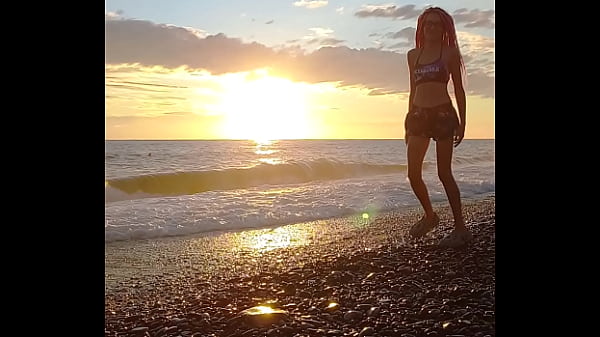 Sunset girl at the sea beach 