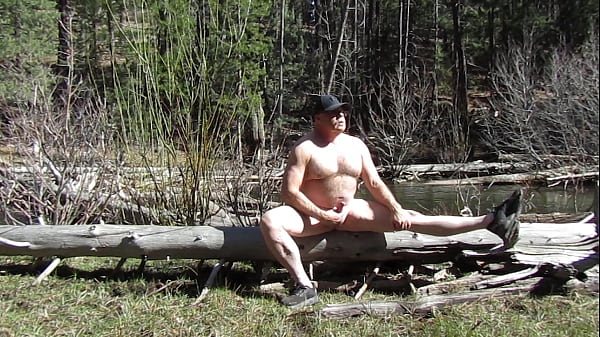 Sitting naked at the river. 