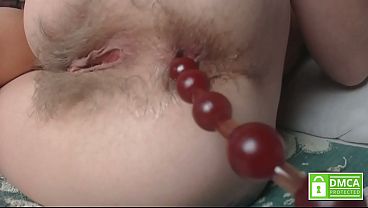 Close up playing with different beads in hairy asshole 