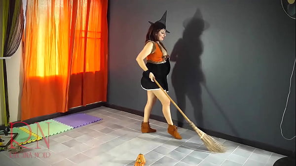 HALLOWEEN 2021Witch in a sexyred suit Red haired witch with_pumpkinsand a broom Regina NoirBackstage