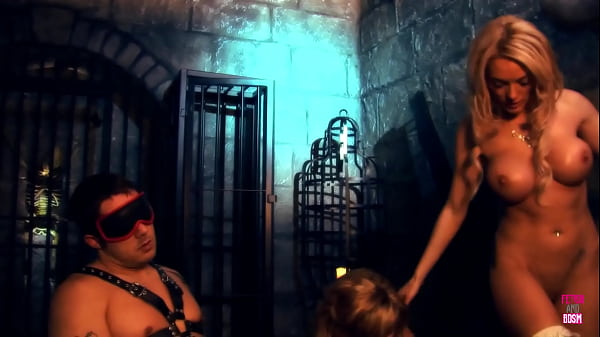 Two Attractive Women With Large Artificial Breasts Are Enjoying Themselves With This Unfortunate Individual thumbnail