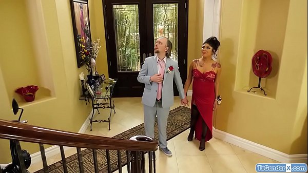TS Beth Bell gets home with her prom date.She sucks his cock and gives him a handjob.He barebacks her as she strokes her dick and she rides his cock 