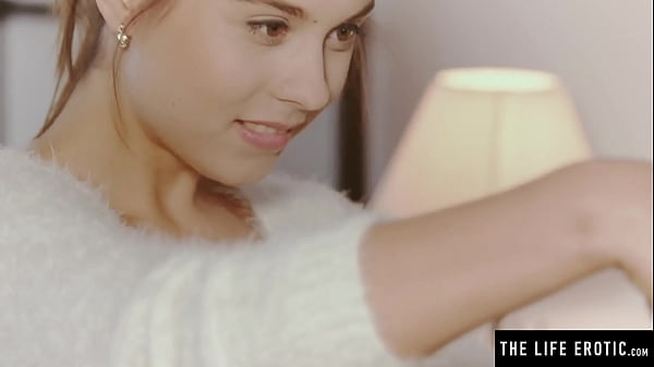 Cute brunette watches herself in the mirror while masturbating