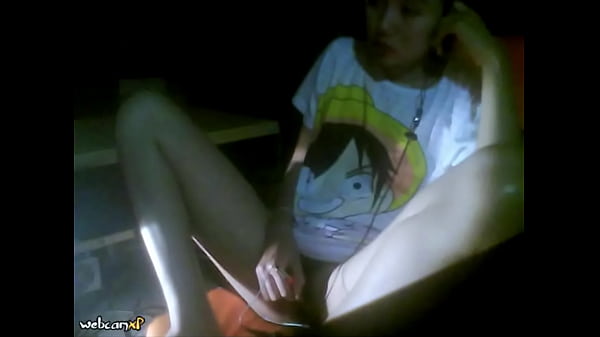 The camera under the table captured a beautiful woman at home alone and watching a porn movie