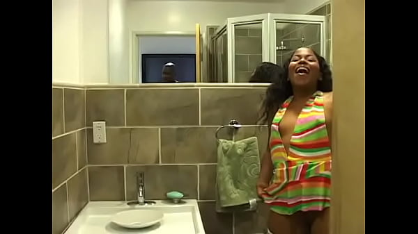 Ebony chick_in white_fishnet_stockings pissing in the toilet_and filming
