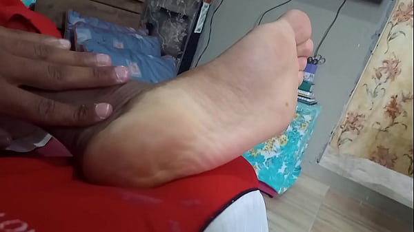 Brazilian male feet moisturizing the feet