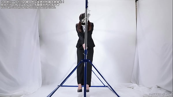 A woman masturbating_over a_rope