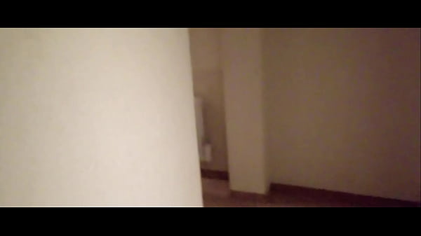 MILF in stockings and heels walks through the corridors of a hotel 