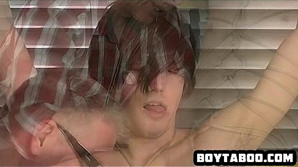 Horny tied up hunk getting his hard cock tugged on 