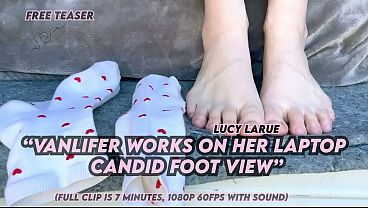 "vanlifer works on her laptop candid foot view"