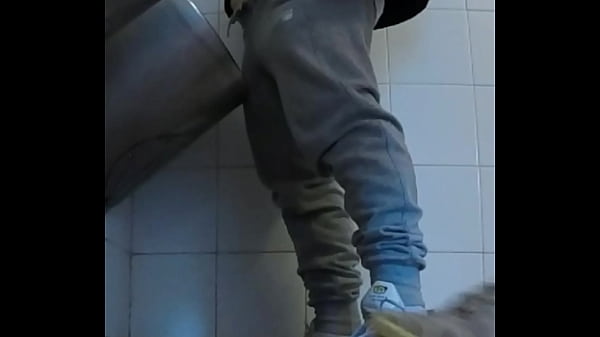 Amateur boys in sneakers wank and try handjob in public toilets' urinal 