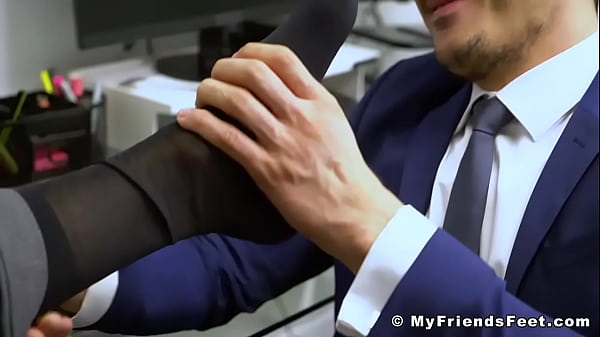 Men in suits smelling feet and toes 