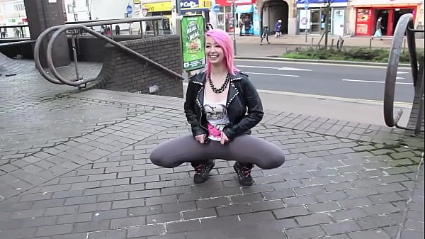 Beautiful and_very slutty slutshows her ass in publicwhile pissing between her legs