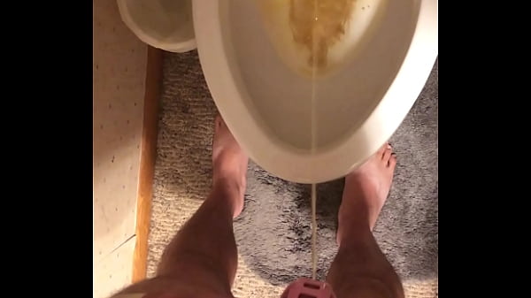 Caged up while taking a pee 