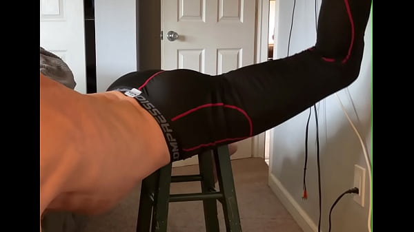 Pain relief on stool in compression pants 