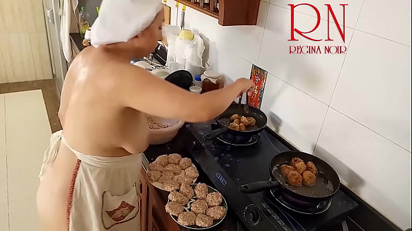 Nudist housewife Regina Noir cooks at the kitchen. Naked maid. Naked housewife. s2 