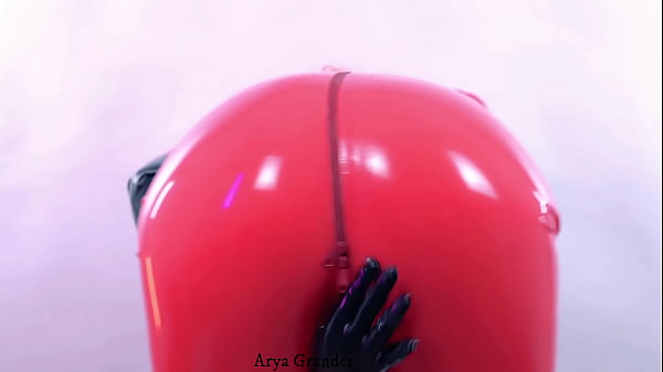 sexy Arya Granderwearing shiny latex clothing and seduce by rubber fetish catsuitfor pleasure