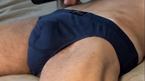 Writhing and Stretchingin Bed_in dark_Briefs Underwearwith 2_massage_guns concentrating on Pelvic andGroin area