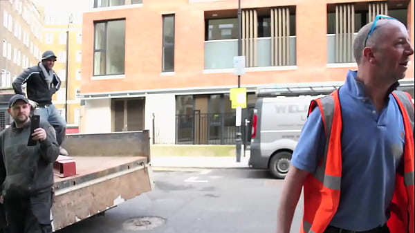 Sexy girl pisses on a_construction site in front of the workers_and shows her tits while walking