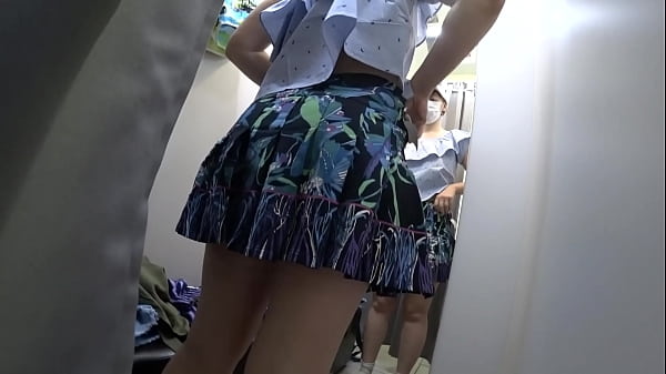 Voyeur in a public shopping center peeps into_the room for a girl with a beautiful_ass. Fetish.