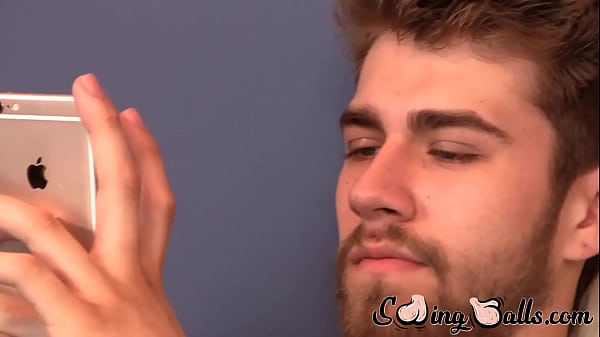 Homo jock tugs hard cock while on phone 