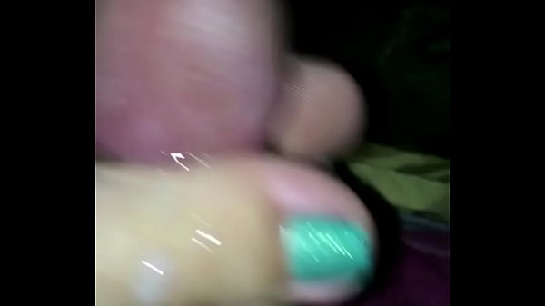 Wife gives closeup footjob cumshot