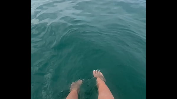 The warm sea water caresses my feet