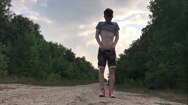 Teenager jerking off on a dusty road