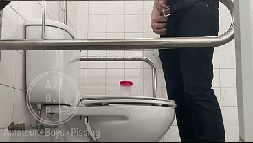 In the Hospital Toilets, a Guy Pisses Into a Cup for a Urine Sample, Then Gets Horny, Jerks-off and Cums