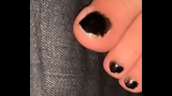 Cute feet black toe nails up close 