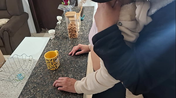 A stepdaughter is surprised while having breakfast