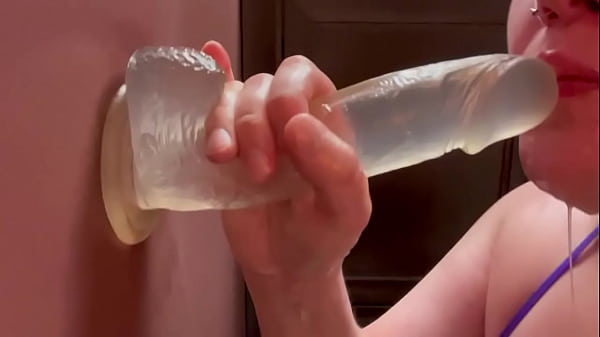 Amateur bouncing tits tease while sucking dildo