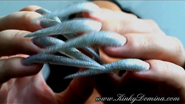 long sharp fingernails in holographic silver, fingernails flicking 