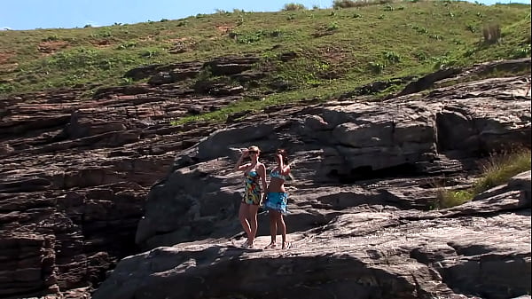 Voyeurs get an eyeful of two hot lesbians fucking on the beach 