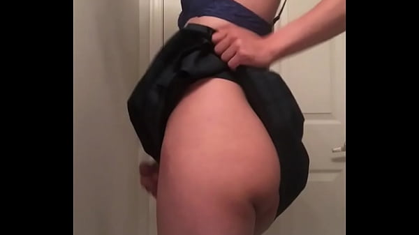 Jess shakes her ass and cock in a skirt