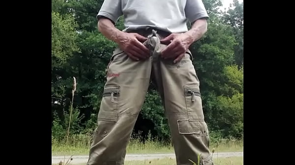 I piss and caress my cock outdoors 