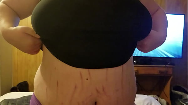 Pulling her boobs out 