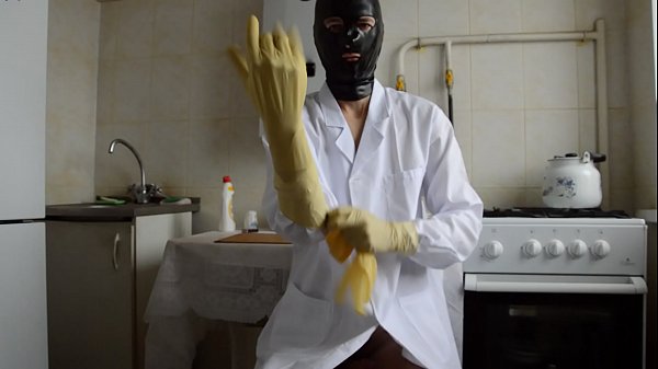 Play MP4 - guy in the medical gown puts on three layers of gloves