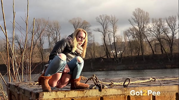 Got2pee Brings Another Desperately Peeing Girl In By The River - Featuring Big Puddle thumbnail