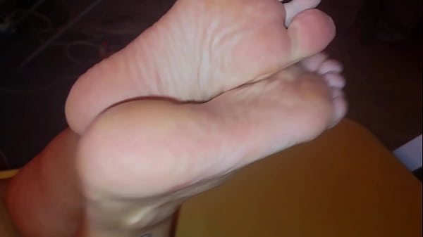 The stepmother allowed the stepson to watch as she lubricates her feet with cream