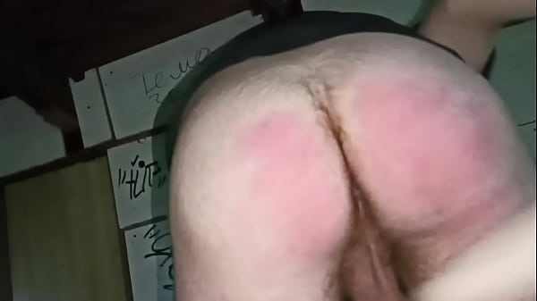 the guy hits himself on the ass with a wooden paddle and then cums in his mouth