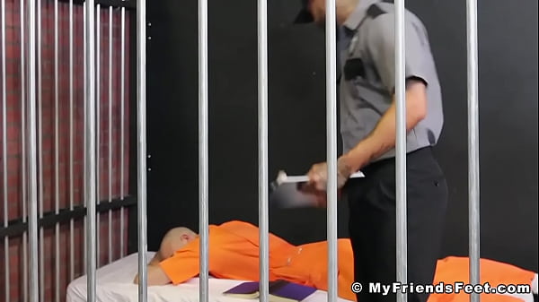 Prison inmate licks toes for hunky guard 